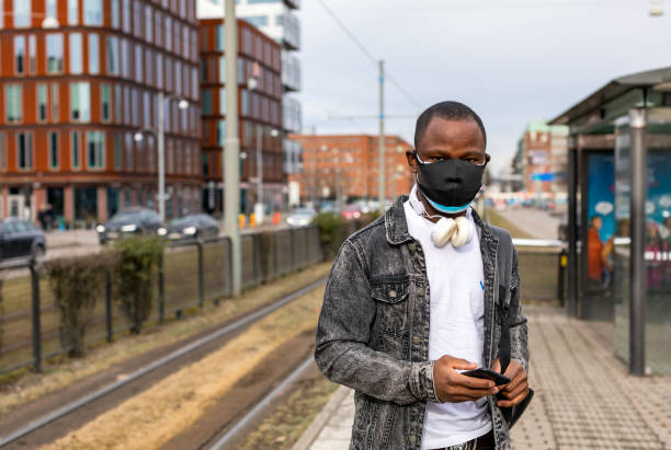 istock Man wearing two face masks 1304756317