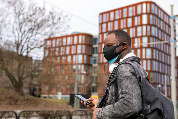 istock Man wearing two face masks 1304756322