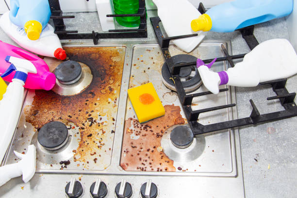 istock dirty kitchen stove, empty and full bottles of detergents around. 1304757459