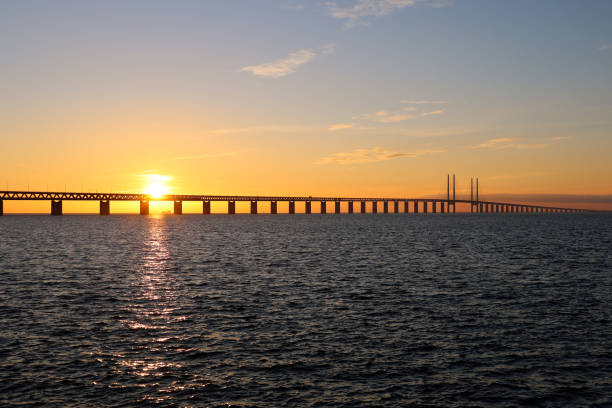 istock Sunset and distant ship under Oresund bridge 1304757943