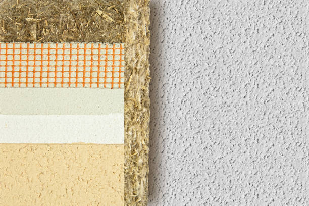 istock Thermal insulation coatings with hemp for building energy efficiency and reduce thermal losses against a plaster wall - Building energy efficiency and savings concept image with copy space 1304760177