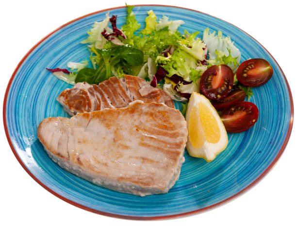 istock Grilled tuna fillet served with vegetable garnish 1304760354