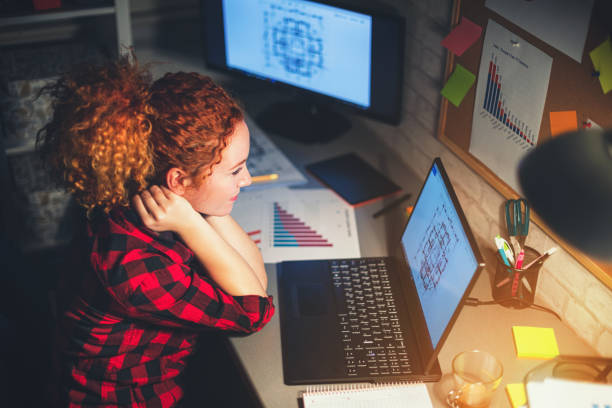 istock Young beautiful freelancer woman working from home late at night 1304761696