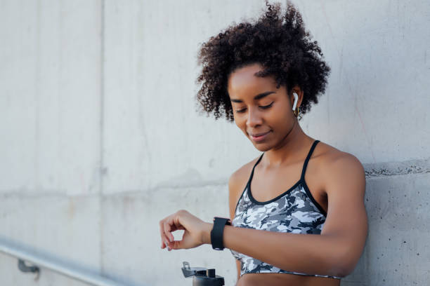 istock Fitness woman checking time on smart watch. 1304762087