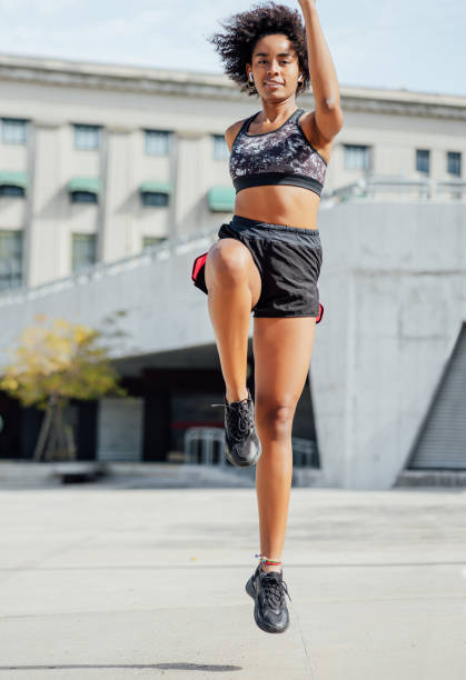 istock Afro athletic woman doing exercise outdoors. 1304762102
