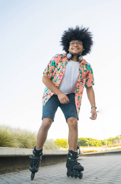 istock Latin man rollerskating outdoors. 1304762215