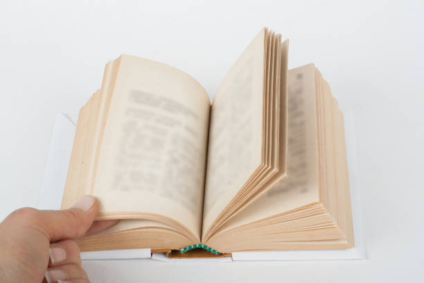 istock Open book, hardback colorful books on white table. Back to school. Copy space for text. Education business concept. 1304763641