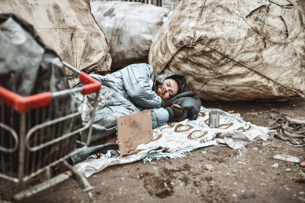 istock Male Beggar Sleeping In The Cold Streets 1304763793