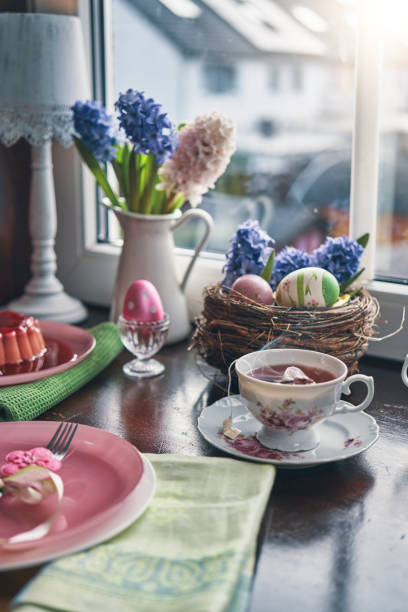 istock Decorated Table for Easter with Easter Eggs, Cookies, Cake and Flowers 1304765999