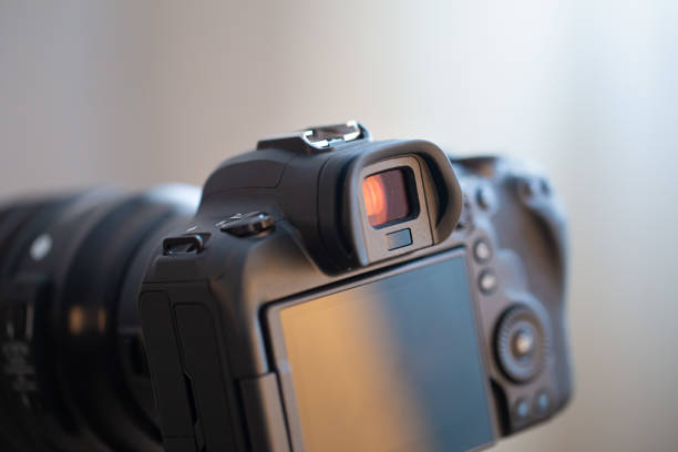 istock Close up part of a professional digital camera on a blurred background. 1304770872
