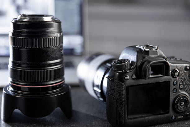 istock Close up of professional digital camera and lens. 1304770875