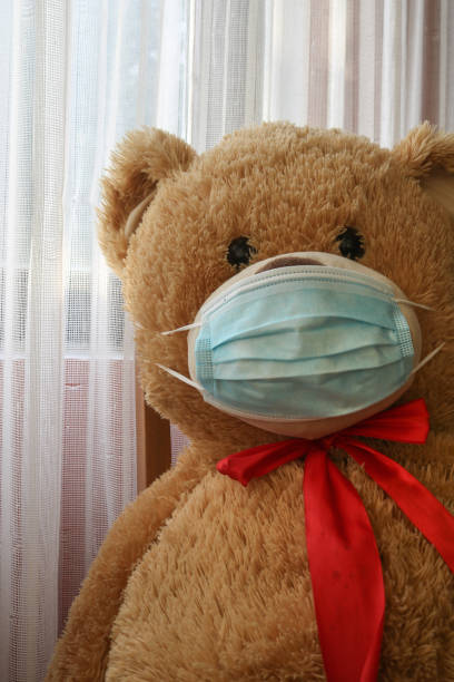 istock Teddy Bear with face mask alone, social distancing concept, Lockdown, Quarantine lifestyle 1304771131