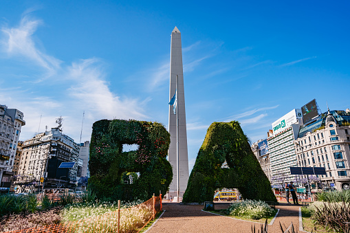 Obelisk of Buenos Aires between Buenos Aires sign made of bushes.