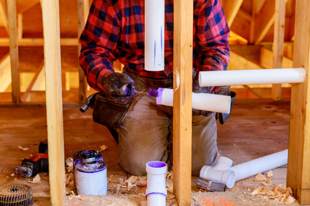 istock Plumbing building contractor installing plastic drain pipe in the elbow for sink drain for a custom house 1304773456