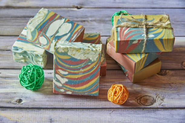 istock Several pieces of multicolored handmade organic soap and various decorations . 1304774012