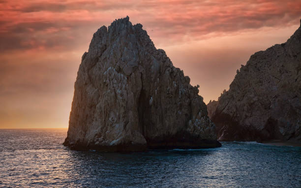 istock Sunset over a Rock Formation in Cabo San Lucas, Mexico 1304774740