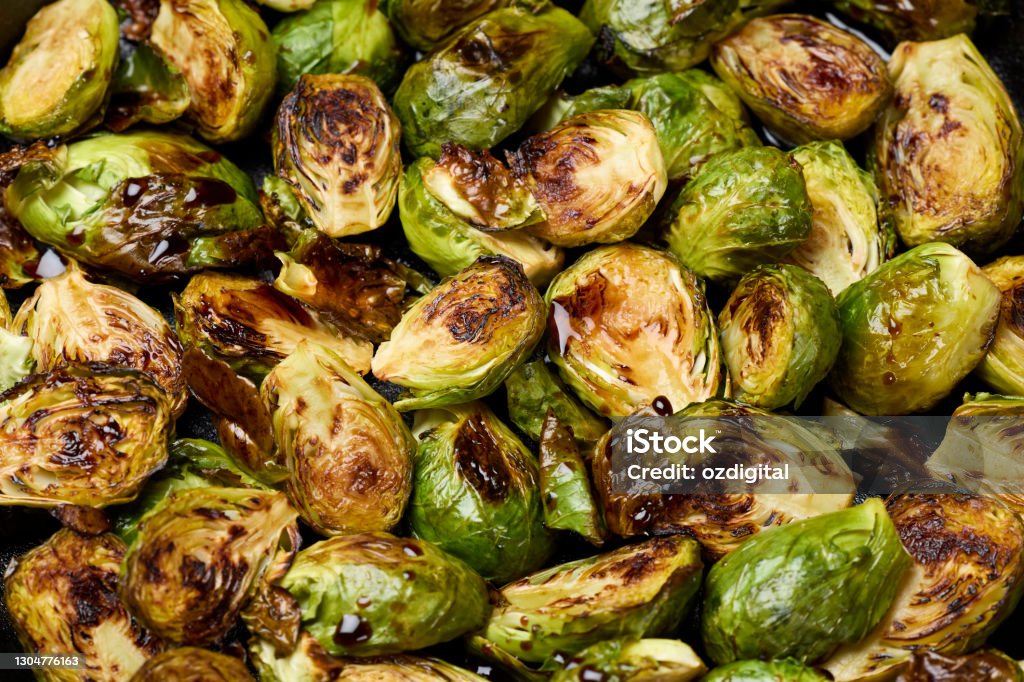 Roasted Brussel sprouts in cast iron pan Brussels Sprout Stock Photo
