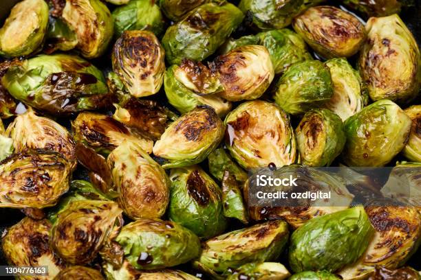 Roasted Brussel Sprouts In Cast Iron Pan Stock Photo - Download Image Now - Brussels Sprout, Roasted, Vegetable