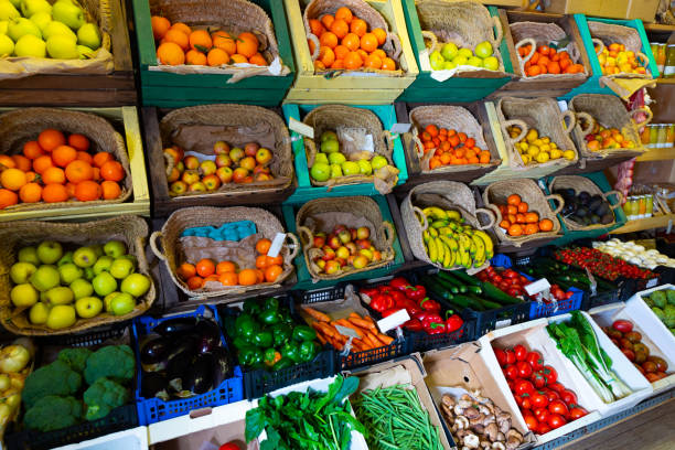 istock Raw fresh vegetables and fruits assortment on counter 1304776581