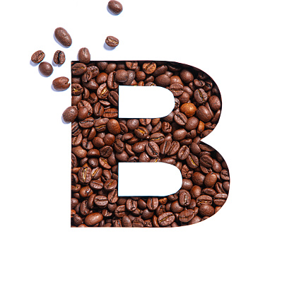 Letter B of English alphabet made of coffee beans and paper cut isolated on white. Typeface for store. High quality photo