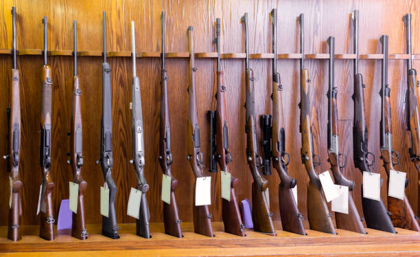 istock Gun store interior with rifles on showcase 1304777515