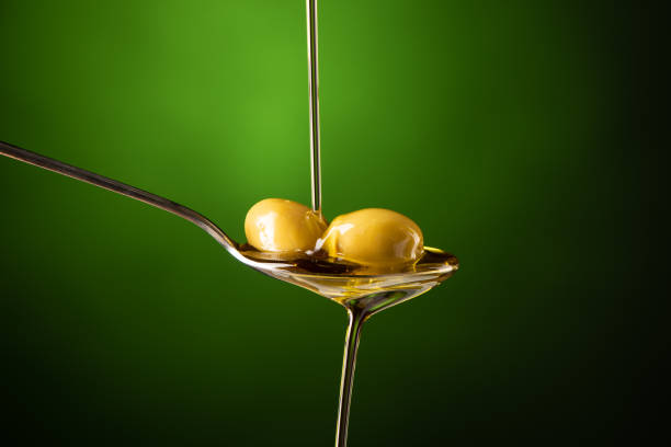 istock Olive oil poured into a spoon 1304779706