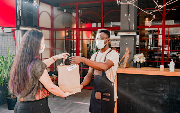 istock Customer pick up takeout food order from waitress 1304780657