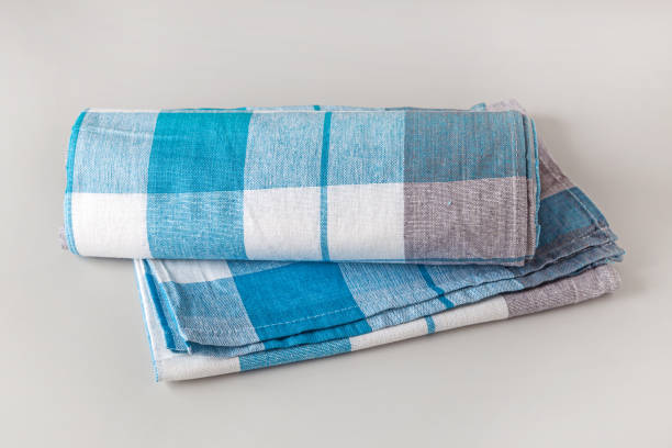 istock new rolled and folded kitchen cotton towels on grey background, selective focus 1304780866
