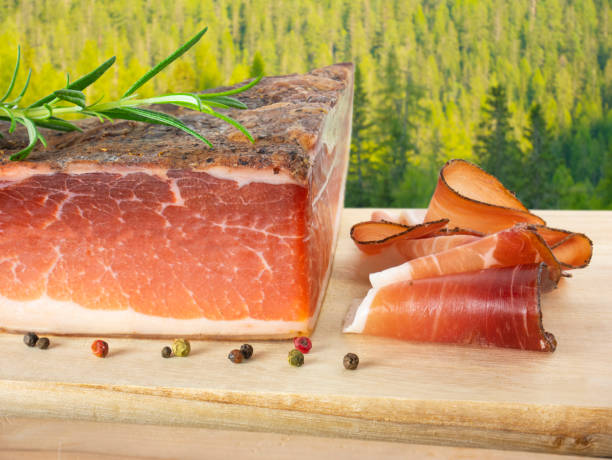 istock Speck, South Tyrolean cured ham, in the alpine mountain forest. 1304781078