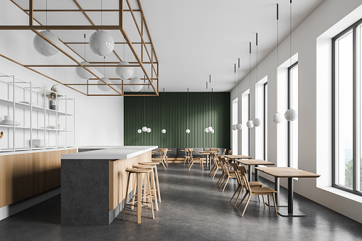 Interior of modern coffee shop with white and green walls, concrete floor, wooden bar counter and square tables with chairs. 3d rendering