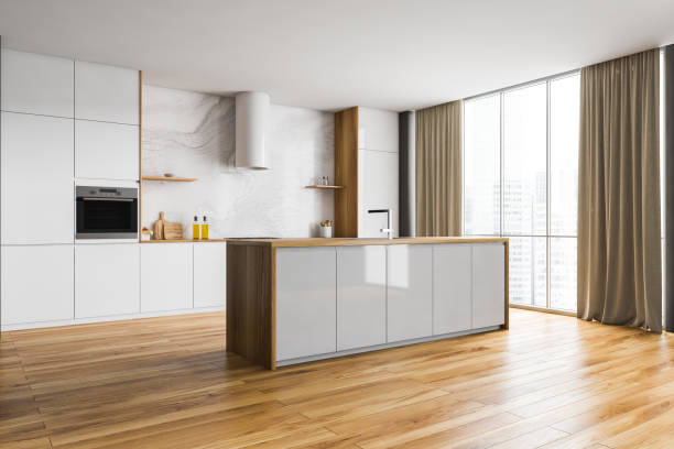 istock Wooden and white kitchen set with table near window with curtains 1304783454