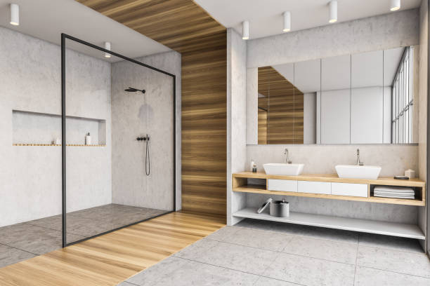 istock Wooden and white bathroom with shower, two sinks and mirror 1304783477