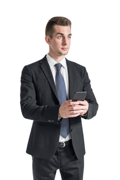 istock Serious young businessman using smartphone, isolated 1304783683