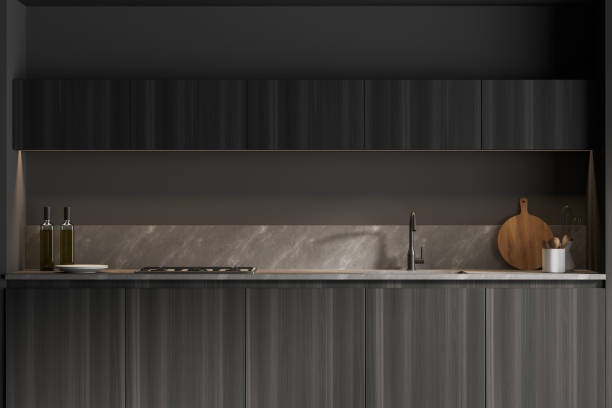 istock Dark wooden kitchen interior with cupboards 1304783854