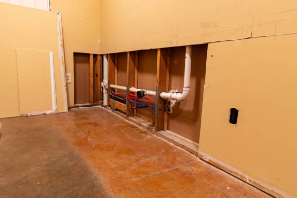 istock Plumbing repairs in wall with sheetrock removed. 1304784971