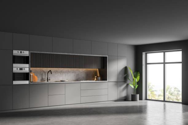 istock Stylish gray and wooden kitchen corner with cupboards 1304785005