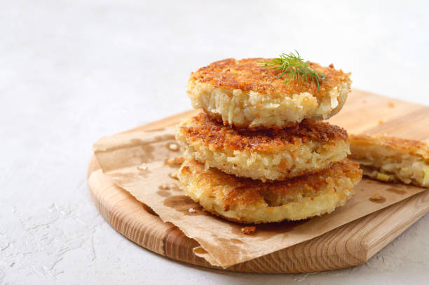 istock Vegetarian pancakes with cabbage on a board. Diet, lean menu. 1304785089