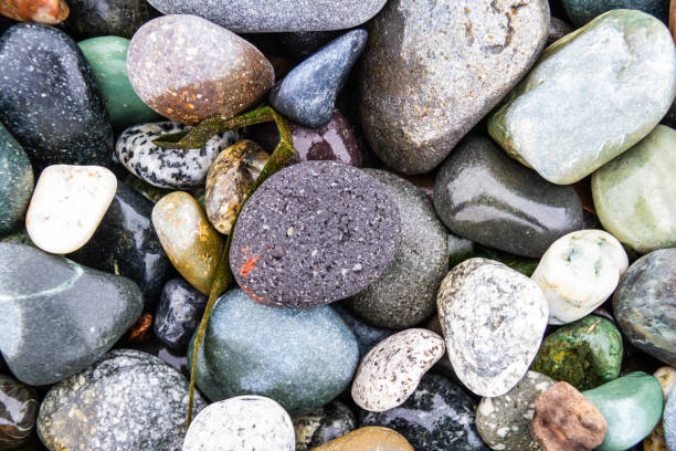 istock Colorful smooth rocks on the beach 1304787349