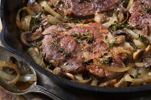 Pan Seared Pork Steak with Mushrooms, Onions and Fresh Thyme