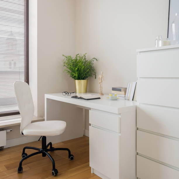 istock Simple white desk with chair 1304791834
