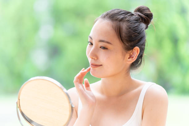 attractive japanese woman skin care image attractive japanese woman skin care image aesthetician photos stock pictures, royalty-free photos & images
