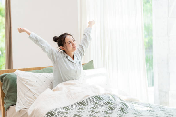 istock attractive japanese woman on the bed 1304799683