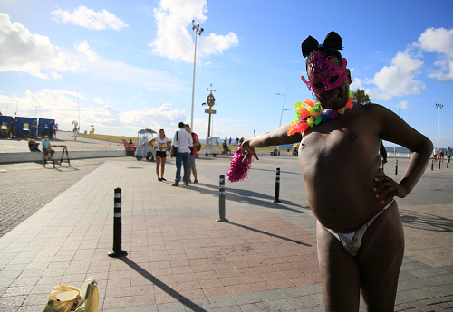 salvador, bahia, brazil - february 12, 2021: person is seen wearing carnival costume during coronavirus pandemic in the city of salvdor.