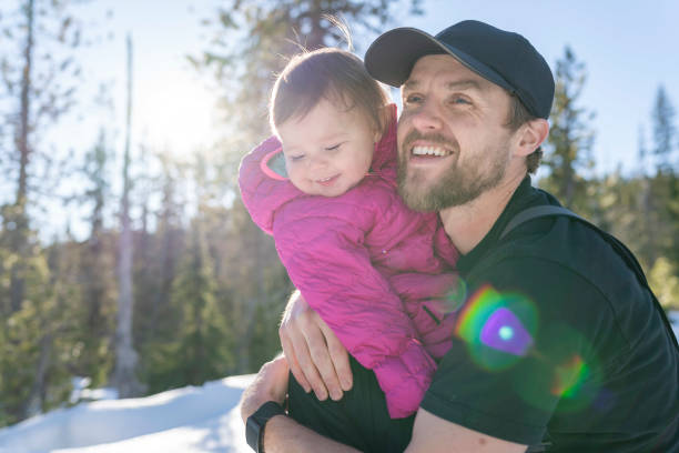 istock Laughing baby playing outside with her dad 1304802203