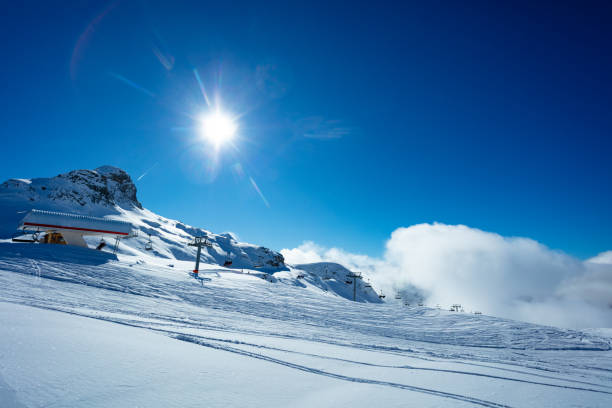 istock Mountain top ski lift station over alpine panorama 1304804029