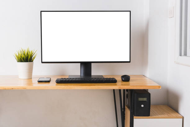 istock Computer monitor with white blank screen on the business desk 1304805364