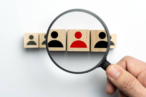 istock Searching for talent or employee conceptual using magnifying glass 1304813861