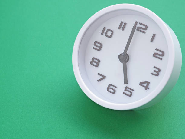 The white clock face, showtime at 5 o'clock on a green background. Space for your text.
