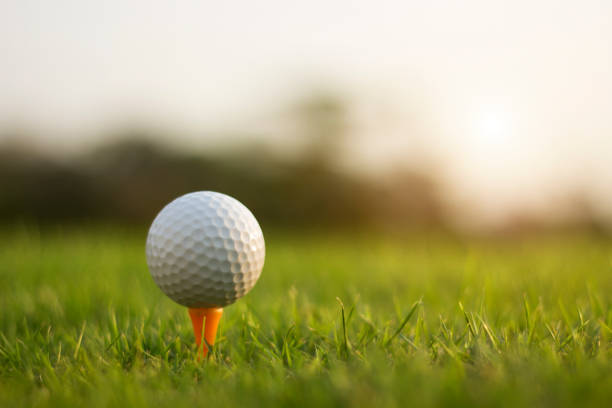 istock golf ball on tee in a beautiful golf course with morning sunshine 1304824365