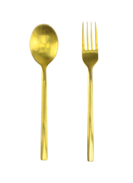 istock Golden spoon and fork isolated on white background.Clipping path 1304824388